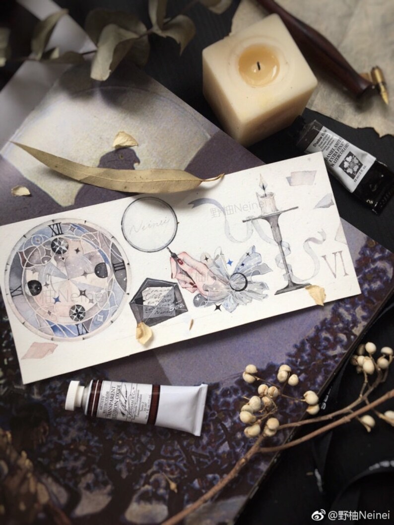 May include: A watercolor painting of a clock face with Roman numerals, a magnifying glass, a hand holding a quill pen, a candlestick, and a book. The painting is on a white background with a few dried leaves and a white candle.
