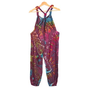 May include: A tie-dye jumpsuit with a halter top and a loose fit. The jumpsuit is made of a soft, comfortable fabric and features a vibrant color scheme with shades of purple, blue, green, and yellow.