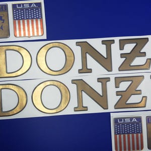 Donzi-botenemblemen 31" goud + GRATIS SNELLE levering DHL Express - Stickersset - Grafische sticker