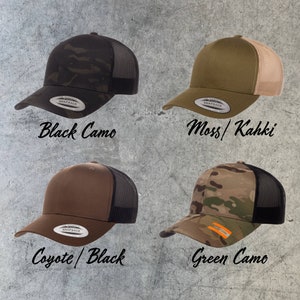 May include: Four different colored trucker hats with black mesh back panels. The hats are in black camo, moss green, brown, and green camo.