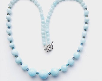 Aquamarine jade, graduated bead necklace with teal, ab coated, bicone, 4mm crystal beads. 22 inches long.