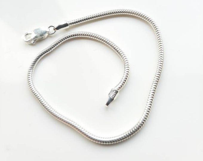 2mm  silver, snake chain bracelet. 2mm wide and seven and a half inches long.