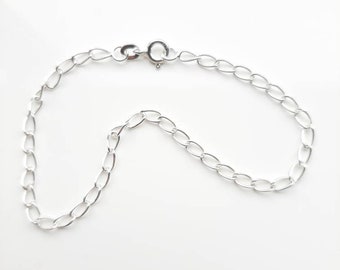 Lightweight, 7 and a half inch, silver curb bracelet. 3mm wide.