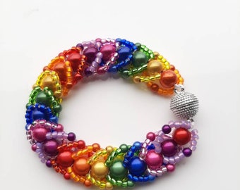 Rainbow, miracle bead, woven bracelet. Pride, NHS. Silver coloured magnetic clasp.