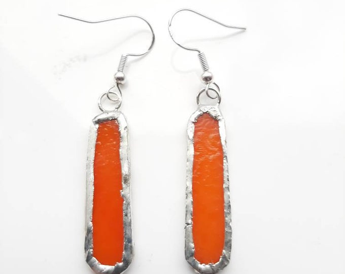 Beautiful, narrow orange, opaque stained glass earrings. Bold and quirky earrings.