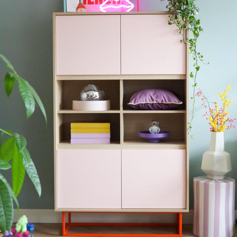 Modern tall cabinet/highboard with light pink doors & orange metal base image 1
