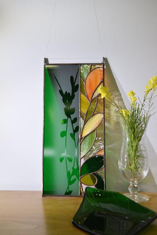 Stained glass warm colours window hanging inspired by nature with sandblasted branch pattern