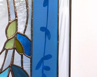 green and blue stained glass suncatcher or window hanging with matted pattern
