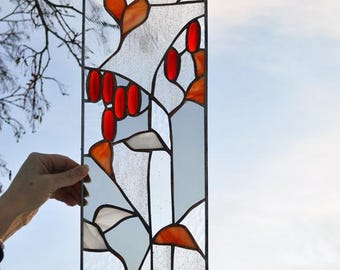 Nature inspired stained glass window hanging with red oval glass berries