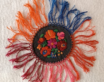 Hand-embroidered doily with long fringes. Handmade Hungarian embroidery ("Matyo" motives)