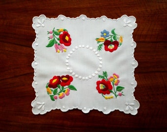 Hand made 10" floral doily, embroidered tabletop.