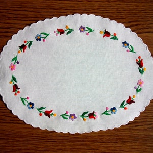 Hand-embroidered oval doily. Handmade Hungarian embroidery (&quot;Kalocsa&quot; motives)