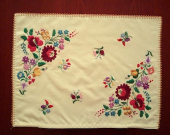 Vintage pillow case with Hungarian embroidery. Home decoration with traditional folk motives.