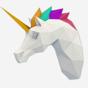 May include: A white origami unicorn head with a yellow horn and a rainbow mane. The mane is made of folded paper in shades of gold, teal, purple, and pink.