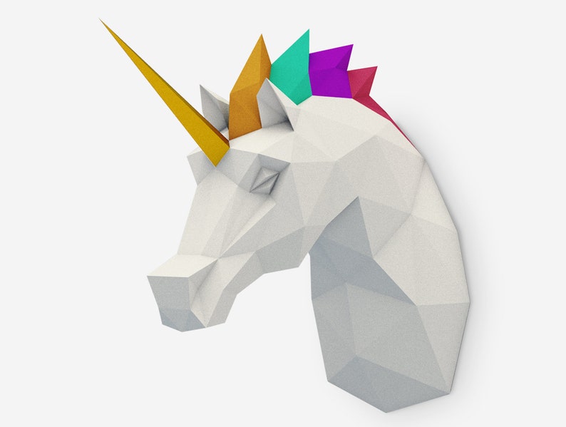 May include: A white origami unicorn head with a gold horn and a colorful mane. The mane is made of paper and is folded into a series of triangles. The colors of the mane are yellow, green, purple, and red.
