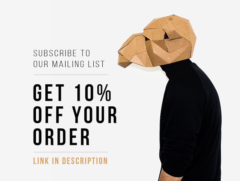 May include: A person wearing a brown cardboard camel mask, standing in front of a white background. The text on the image reads: "Subscribe to our mailing list. Get 10% off your order. Link in description."