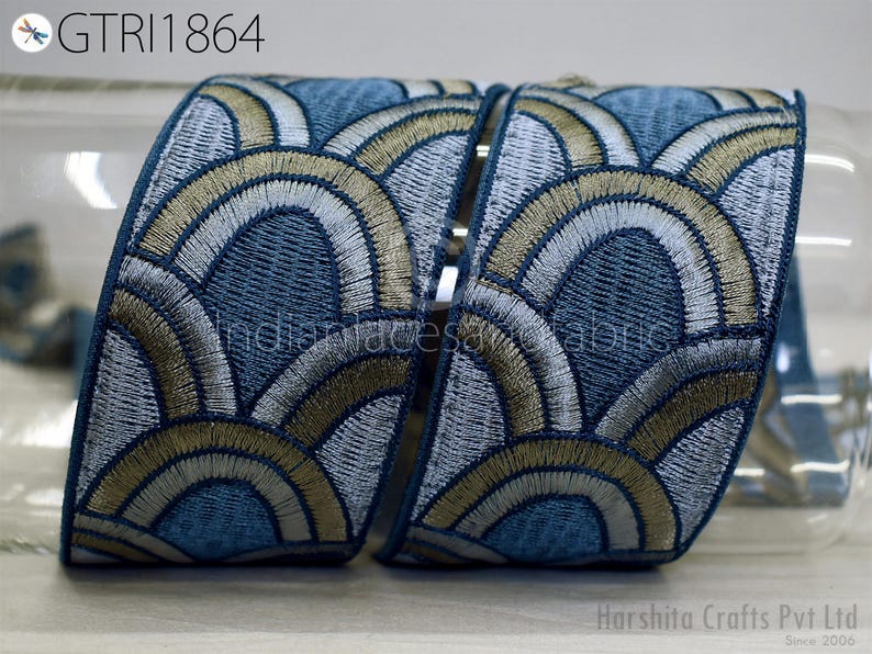 a decorative fabric with a repeating pattern of blue and gold circles, creating a visually appealing and intricate design.