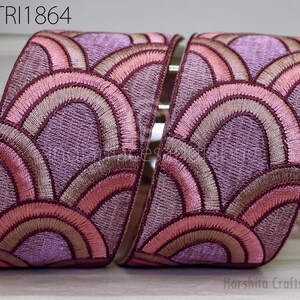 a pair of decorative fabric pieces with a repeating pattern of pink and purple waves or circles. The text "GTRI1864" is visible in the image.