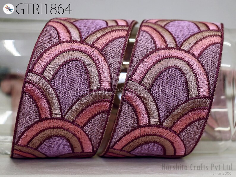 a pair of decorative fabric pieces with a repeating pattern of pink and purple waves or circles. The text "GTRI1864" is visible in the image.