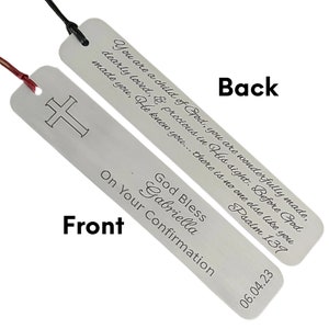 May include: Silver bookmark with a cross on the front and a religious inscription on the back. The inscription reads "You are a child of God, you are wonderfully made, dearly loved, & precious in His sight. Before God made you, He knew you... there is no one else like you Psalm 139". The bookmark also includes the text "God Bless Gabriella On Your Confirmation 06.04.23".