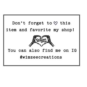 May include: A white rectangular card with black text. The text reads "Don't forget to ♡ this item and favorite my shop!" and "You can also find me on IG @wimzeecreations". A heart made of skeleton hands is in the center.