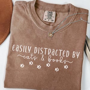 Easily Distracted by Cats and Books Comfort Colors® Book Lover Shirt Funny Cat Shirt Cat Mom Gift Librarian Reader Tee Cozy