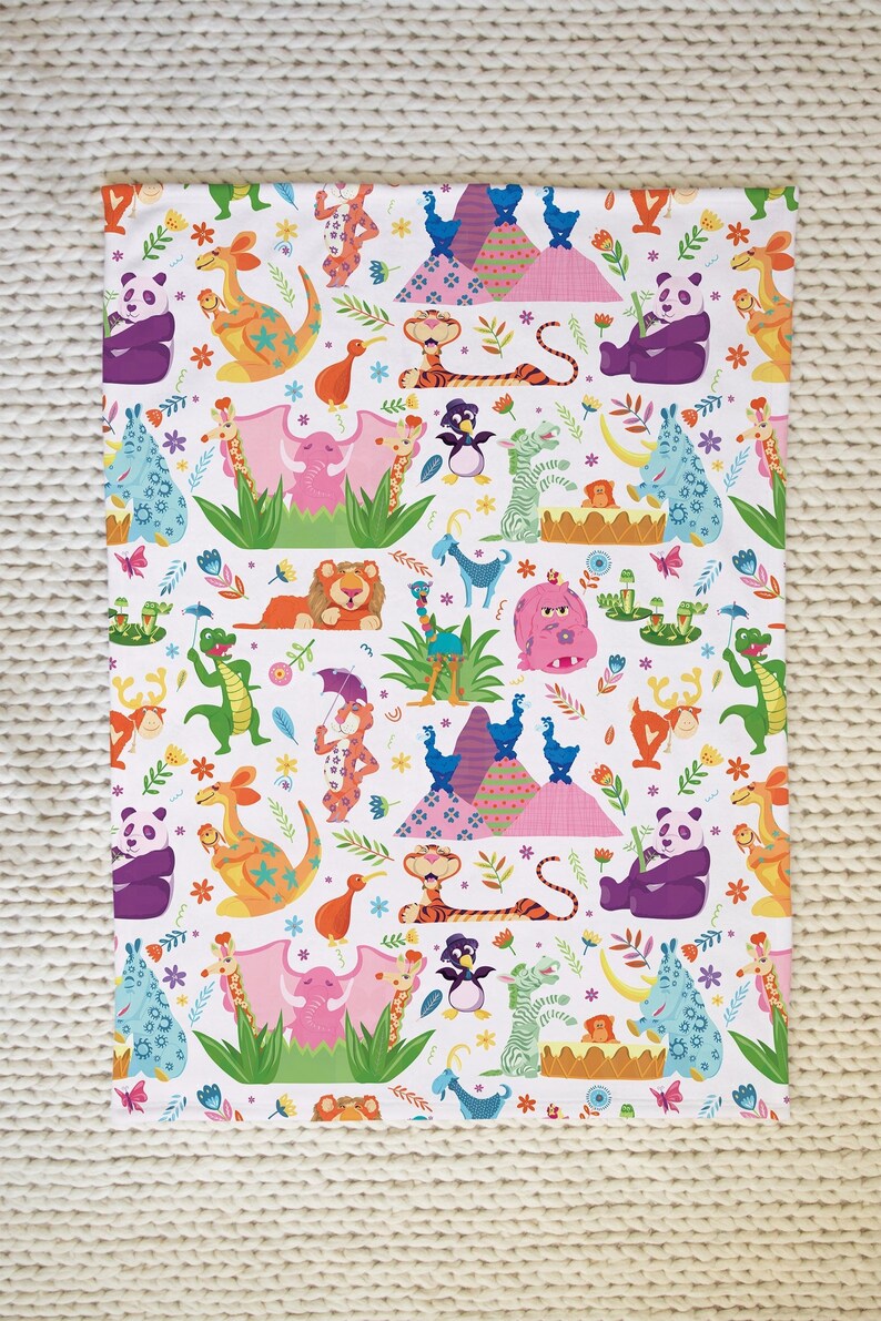 May include: A white fabric with a colorful pattern of animals, including a panda, kangaroo, elephant, giraffe, tiger, penguin, zebra, rhino, and a monkey playing a drum. The background is white with small flowers and green leaves.