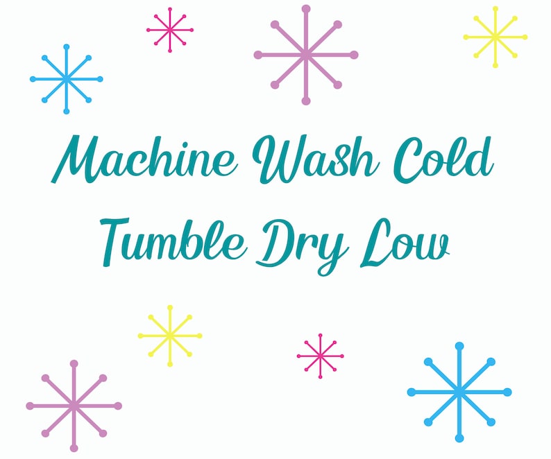 May include: A white background with the text "Machine Wash Cold Tumble Dry Low" in teal blue.  There are nine snowflakes in various colors, including pink, blue, and yellow.