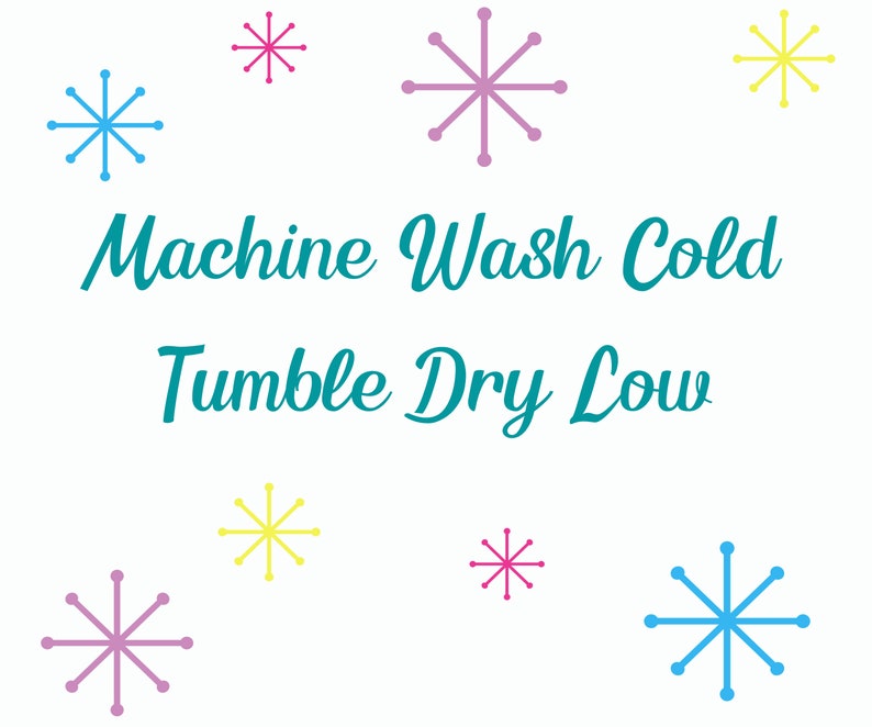 May include: A white background with the text "Machine Wash Cold Tumble Dry Low" in teal blue.  There are nine snowflakes in various colors, including pink, blue, and yellow.