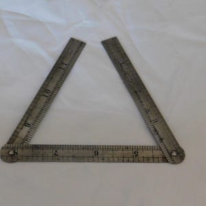 May include: A rustic wooden sign with the text "Welcome to our home" in white lettering. The sign features a distressed finish and a simple, inviting design, perfect for a front porch or entryway.