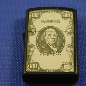 Vintage Collectible Cigarette Lighter with 100 dollar bill.