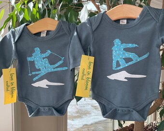 Baby Ski or Snowboard one piece organic cotton long sleeve gray with snowflakes. Baby shower gift from Cool Uncle or Best Aunt. Winter baby