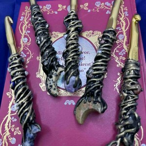 The upper handle showcases celestial beauty and gemstone energy, while the lower half of each crochet hook is purposefully left unembellished to maintain smooth stitch flow and precision. This thoughtful design ensures your tools remain comfortable, efficient, and inspiring to use—whether you're crocheting a cozy blanket or a spiritual keepsake.