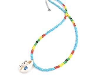 Blue seed and cowrie love choker necklace