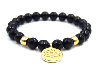 Elastic bracelet black onyx beads lotus flower gold plated