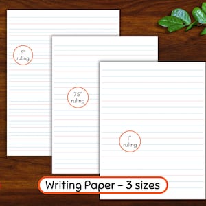 May include: White writing paper in three sizes with blue and red horizontal lines. The sizes are indicated as .5", .75", and 1" ruling. Two pencils, one green and one blue, are on the left. The text "Writing Paper - 3 sizes" is at the bottom.