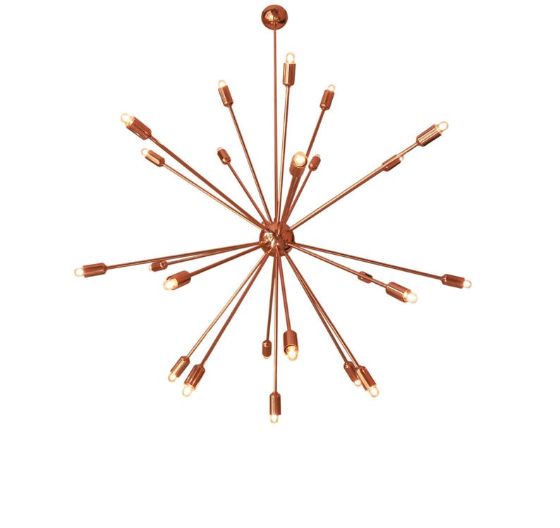May include: A copper-toned chandelier with multiple arms extending outward, each ending in a light bulb. The chandelier has a starburst design.