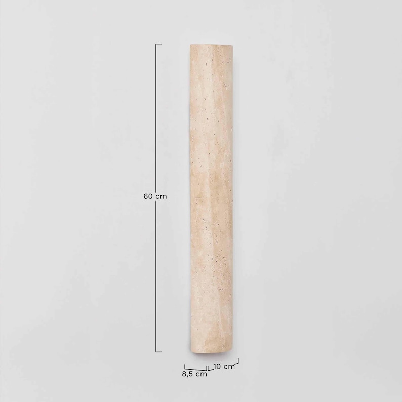 May include: A beige, rectangular decorative pillar, 60 cm tall and 8.5 cm by 10 cm wide. The pillar has a textured surface and is set against a plain white background. The pillar is made of a natural material.