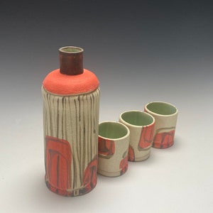 Modern handmade sake set with abstract design in tropical red by PotterYi.