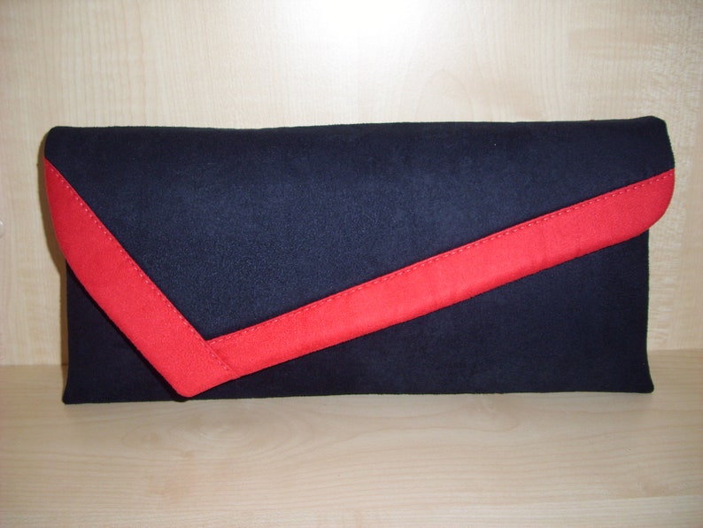 navy blue and white clutch bag