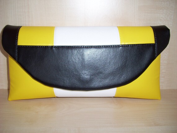 black and yellow clutch bag