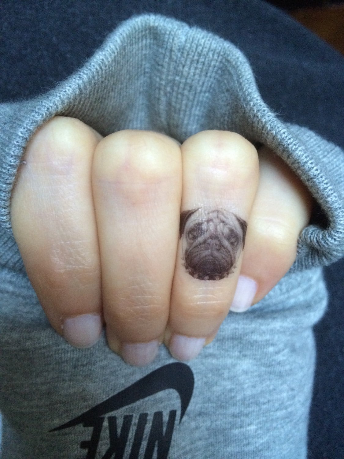 Micro-realistic portrait tattoo of a Pug located on the