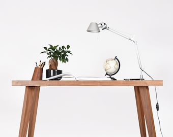 Small modern desk in walnut with a black top in Mid Century style