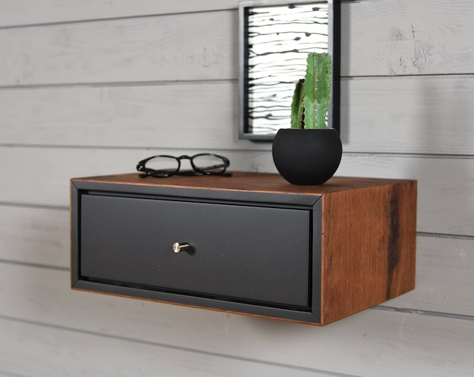 black floating bedside table with 1 old wooden box