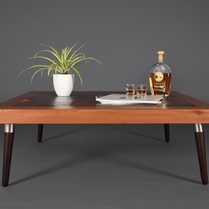 Mid-century square coffee table in leather and wood