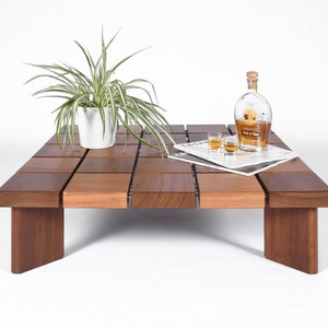Low square coffee table in solid Iroko wood