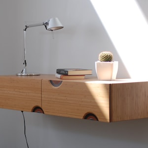 Floating entryway console in bamboo with 2 carved drawers