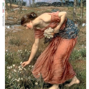 May include: A woman in a long, flowing red dress with a blue sash is picking white flowers in a field. The flowers are growing in a patch of green grass. The woman is barefoot and her hair is long and dark.