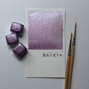 Margie shimmer glitter purple watercolor paint half pan for calligraphy, art, crafts, lettering, pointed pen, white and black paper