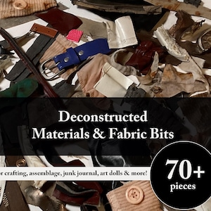 May include: A collection of assorted deconstructed materials and fabric bits including a blue belt, various textile scraps, and buttons. The image features the text Deconstructed Materials & Fabric Bits and 70+ pieces. The assortment contains various textures, colours, and shapes of mixed media components for creative projects.